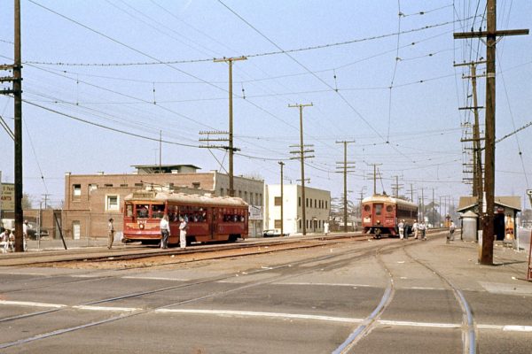 LAMTA 1812 with an Electric Railroaders Association fantrip passes LAMTA 1542 with an inbound Long Beach train at Watts on March 20, 1960. 
 This excursion was the last use of a Hollywood car on the former Pacific Electric. Charles Seims Photo.