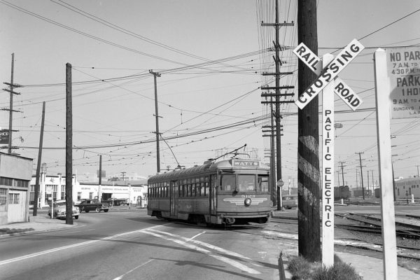Metropolitan Coach Lines 5123 with the outbound Watts Local entering private right-of-way at  Olympic and Hooper Ave on February 16, 1958. Photographer Stan Kistler, Jeffrey J Moreau Collection