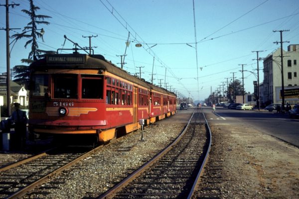 MCL 5166 leads a three car train on the Glendale- Burbank Line at Brand Blvd and Burchette St   in Glendale, circa 1955. Photographer Walter Abbenseth.