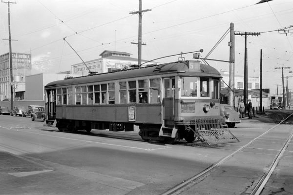 LARy 1450 southbound on the 5 Line on Grand Ave crossing the Pacific Electric Santa Monica Air Line, February 1941.  Jeffrey J Moreau Collection.
